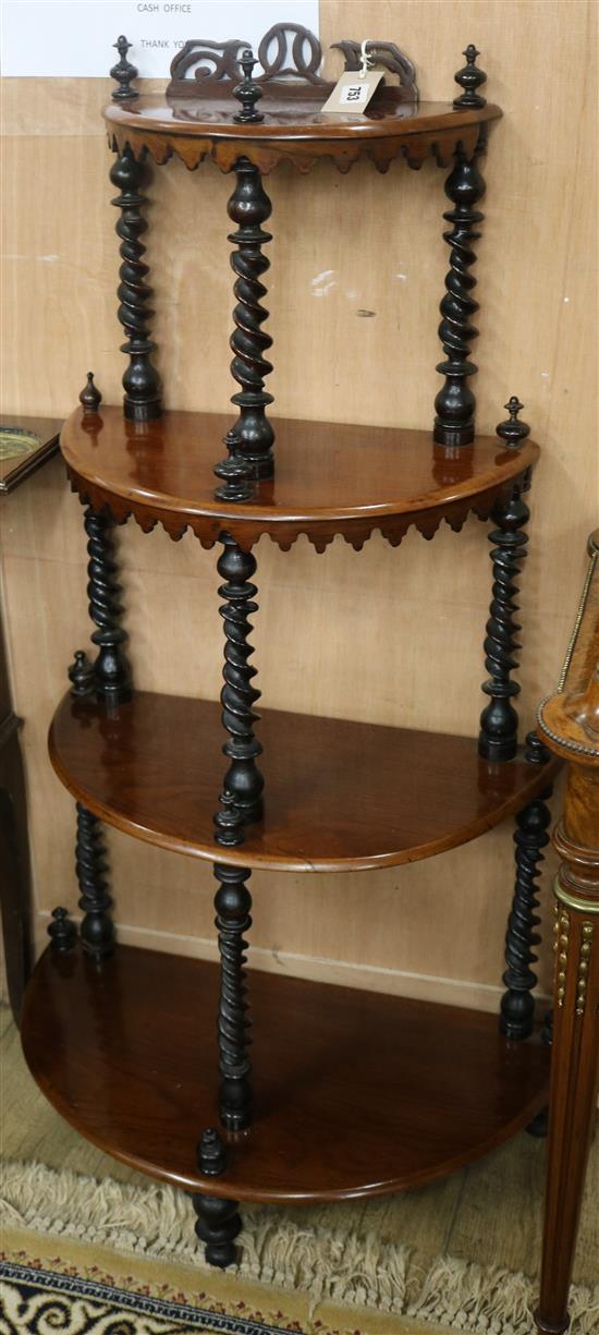 A Victorian mahogany bow fronted four tier whatnot W.63cm